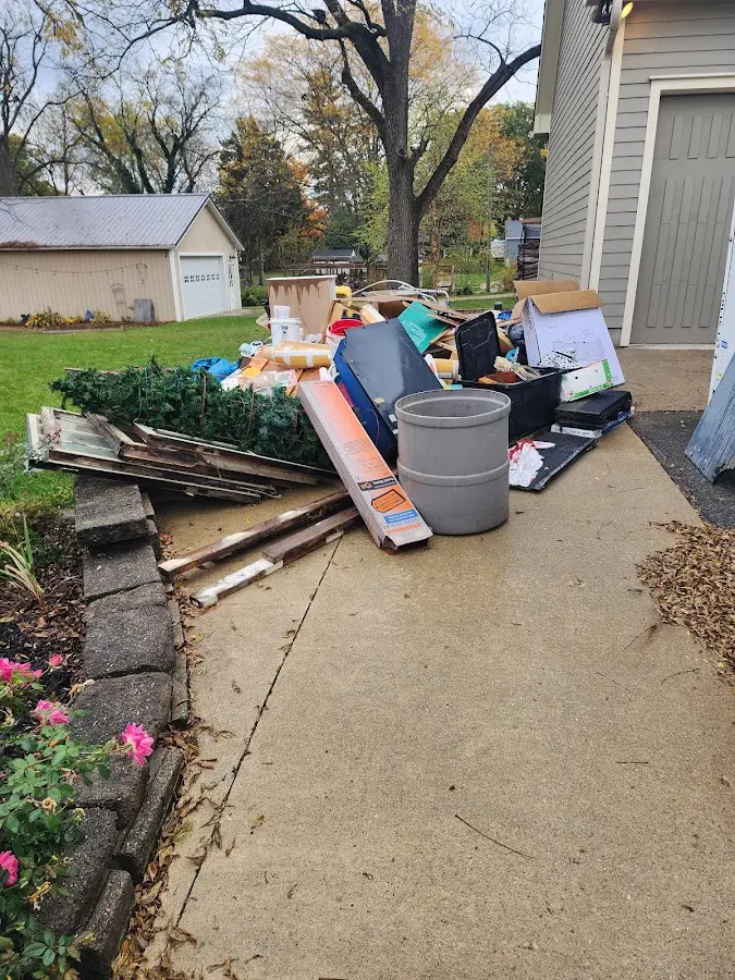 Dumpster being loaded with debris for Residential Dumpster Rental in Biloxi